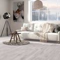 Aire Blanco 20x120cm pale grey wood effect porcelain plank flooring in a room setting