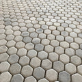 Full sheet of Carrara white hexagon mosaic viewed square on, showing veining variation between pieces