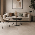 Mayfair Beige 60 x 60cm glazed porcelain tile in a  Modern living room with a beige sofa, coffee table, and decorative elements.