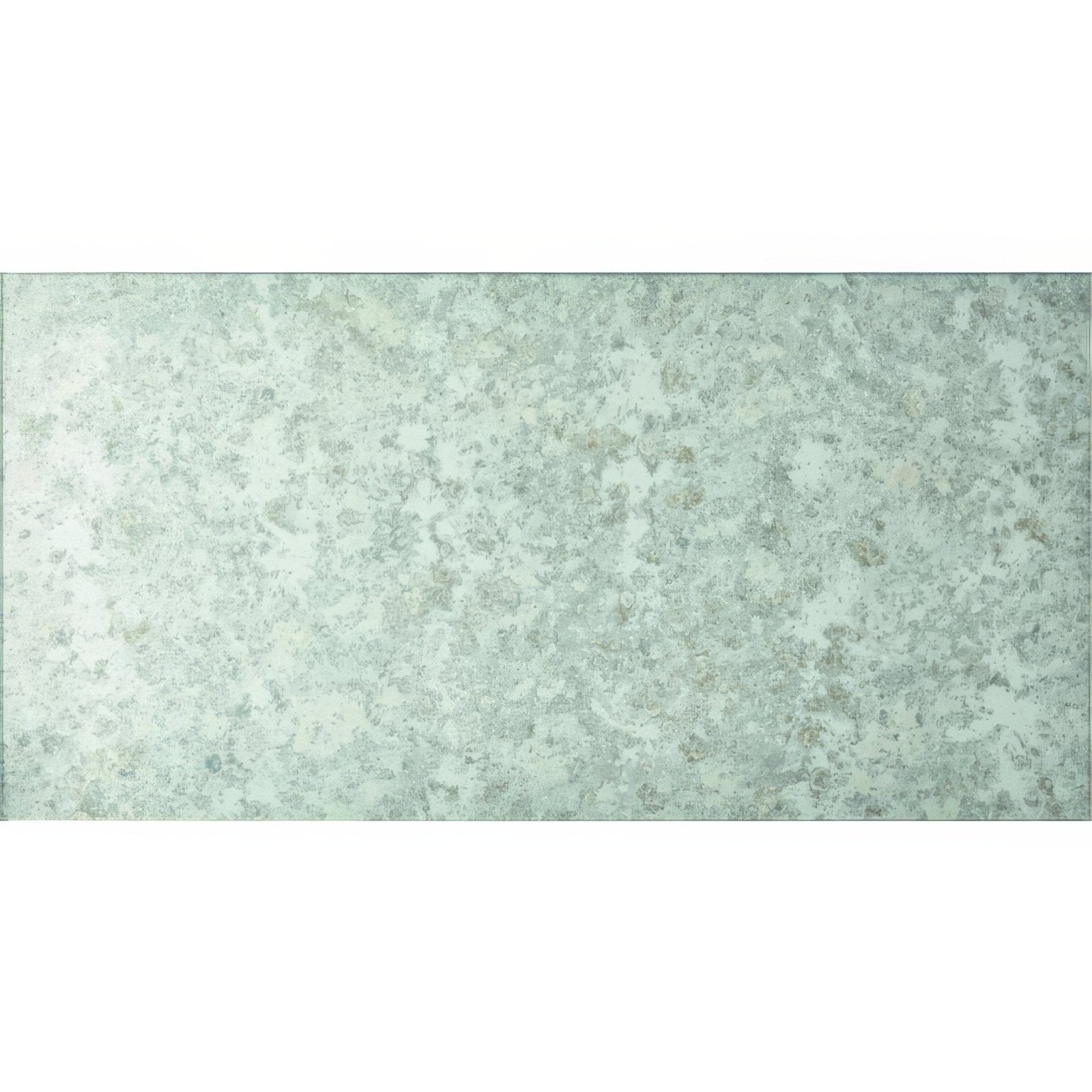 A large format 600 x 300mm rectangular antique mirror tile with distressed green mottled vintage patina finish