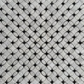 Close detail of a single Carrara marble flower with its polished black Nero Marquina centre
