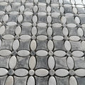 Polished Carrara and Platinum Grey marble flower mosaic used as a bathroom floor