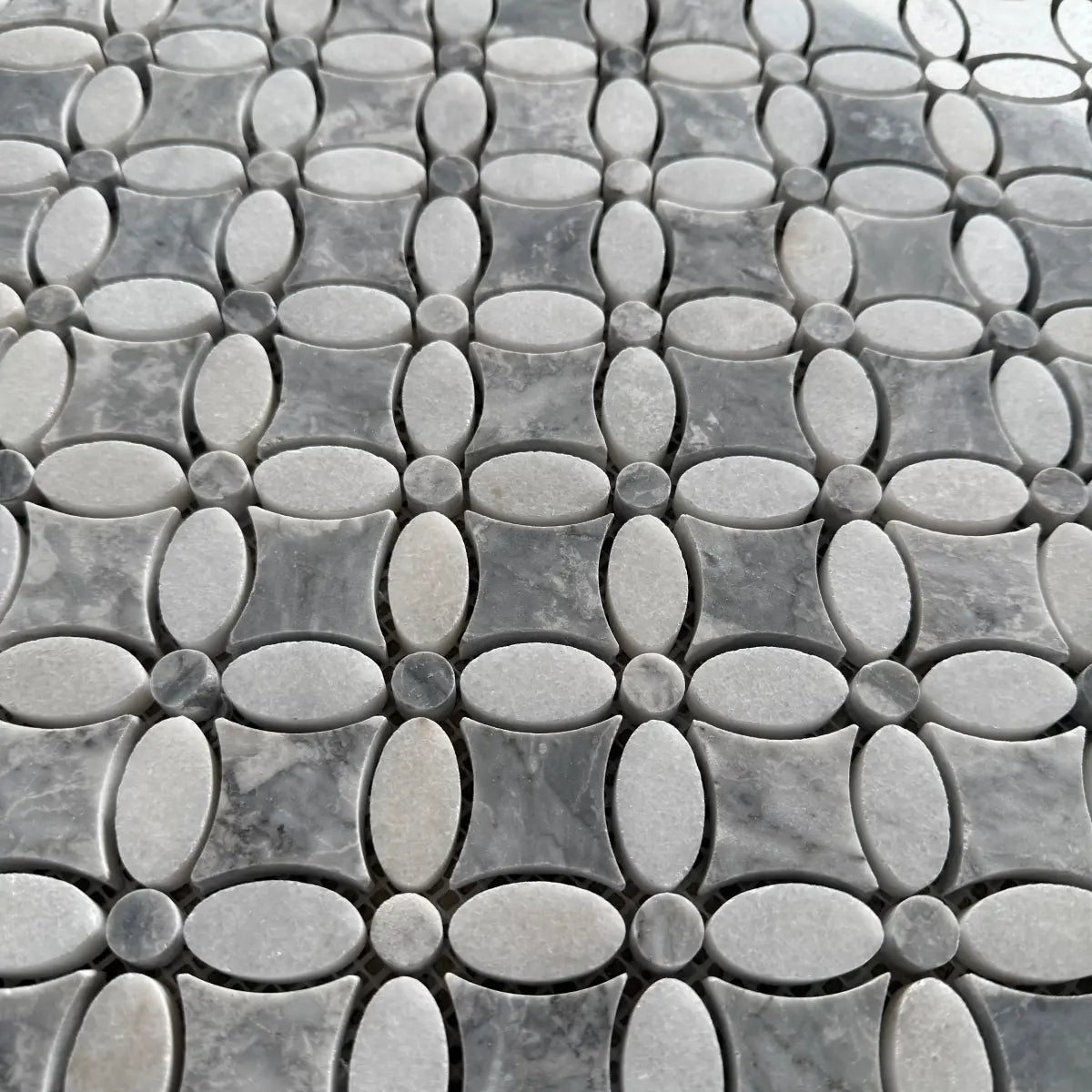 Polished Carrara and Platinum Grey marble flower mosaic used as a bathroom floor