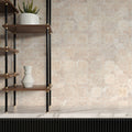 Angled view showing the natural banding and open pores across tumbled travertine Casablanca pieces
