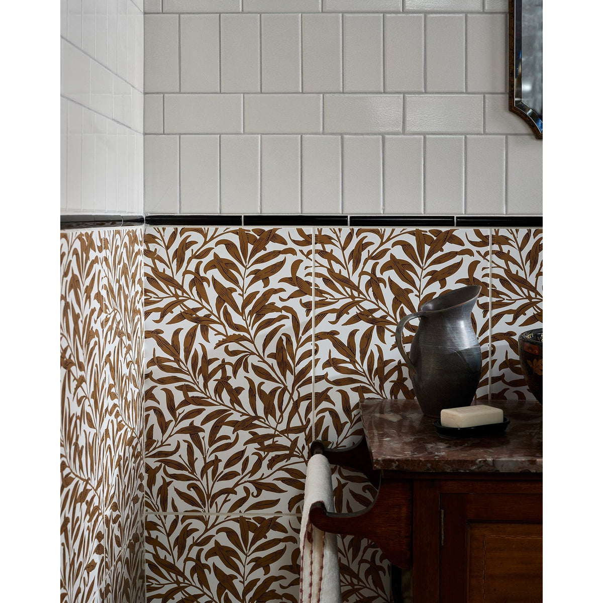 Ca'Pietra Architectural Ceramic Bead Moulding in glossy black, 20 x 2 x 2cm, shown on a tiled wall