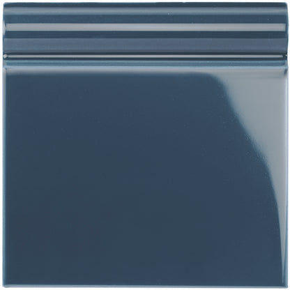 Ascot blue skirting tile in dark blue glossy ceramic with a subtle ridged border for wall edging