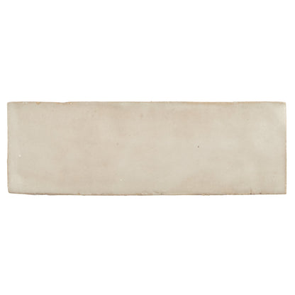 Cream-colored rectangular ceramic tile with a matte textured finish from Medina cloudy white handmade Moroccan zellige tile collection
