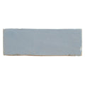 Medina cornflower blue rectangle handmade Moroccan zellige tile in matte light blue ceramic with earthy undertones and uneven edges