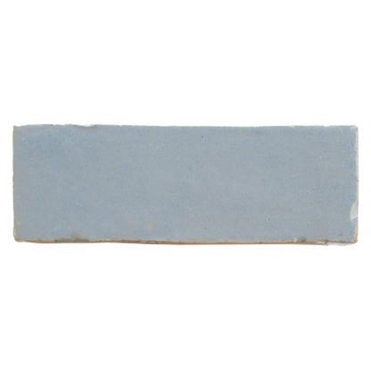Medina cornflower blue rectangle handmade Moroccan zellige tile in matte light blue ceramic with earthy undertones and uneven edges