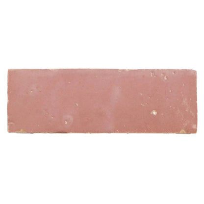 A rectangular handmade moroccan zellige tile with a matte terracotta leather pale finish and subtle surface imperfections