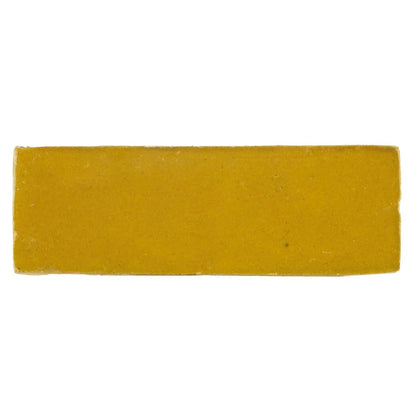 Medina ochre rectangle handmade moroccan zellige tile featuring a solid yellow rectangular bar of soap with textured surface