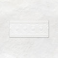 White rectangular ceramic baroque moulding helmingham tile with raised circular and beaded decorative patterns