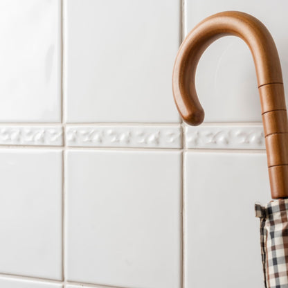 Beaulieu Moulding Helmingham polished wooden umbrella handle with curved ergonomic grip and subtle horizontal grooves