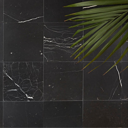 Chequers Court black marble tiles featuring elegant white veining for sophisticated interior design