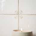 Country Delft Ada Taupe tile wall with a decorative taupe floral pattern
