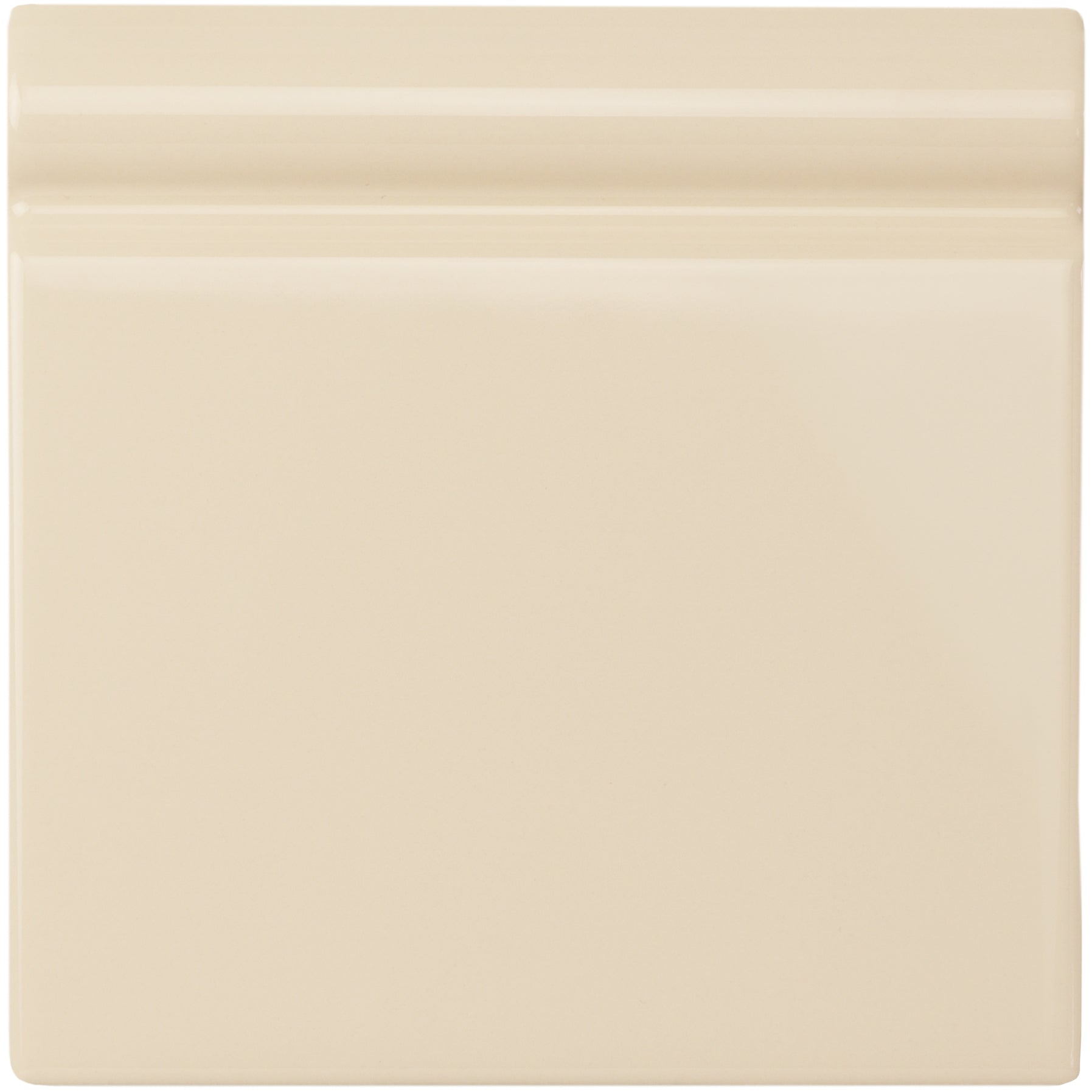 Cream-colored county white skirting tile with smooth glossy ceramic finish and subtle horizontal ridges on top edge