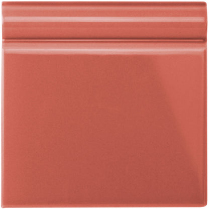 Duchy pink skirting tile ceramic with smooth glossy terracotta finish and subtle horizontal ridges on top edge