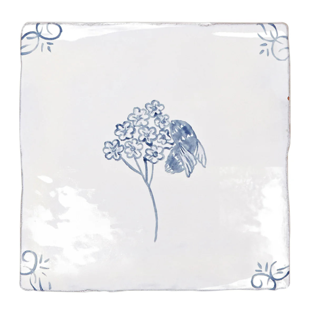 White ceramic tile with delicate blue hand-painted flowers and a bee English Delft bee blue gloss tile