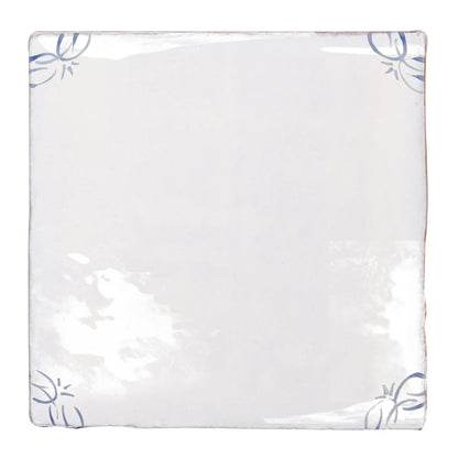 English delft blue gloss corner tile in white ceramic with delicate blue floral motifs in each corner