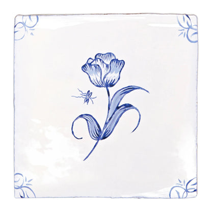 A white ceramic English Delft tulip blue gloss tile with delicate hand-painted blue tulip and corner floral motifs