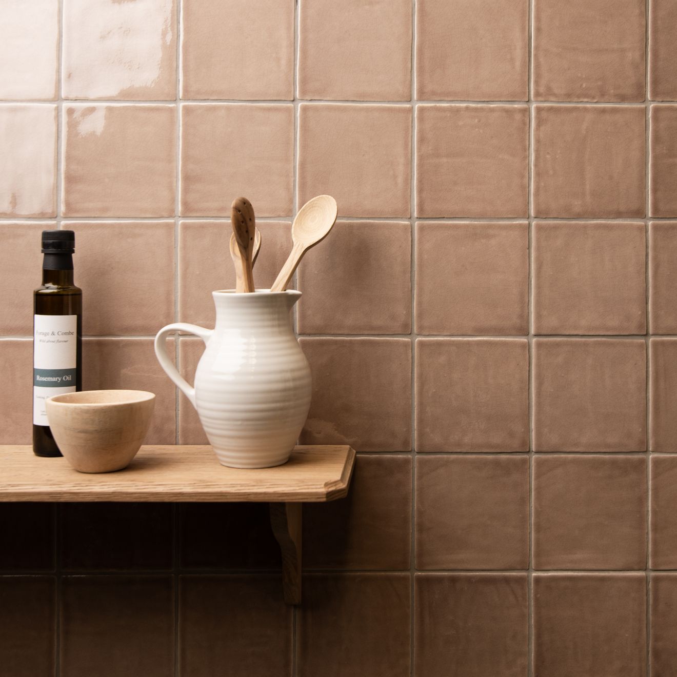 Cream-colored ceramic pitcher with vertical ridges and handle holding wooden spoons field tile birch design