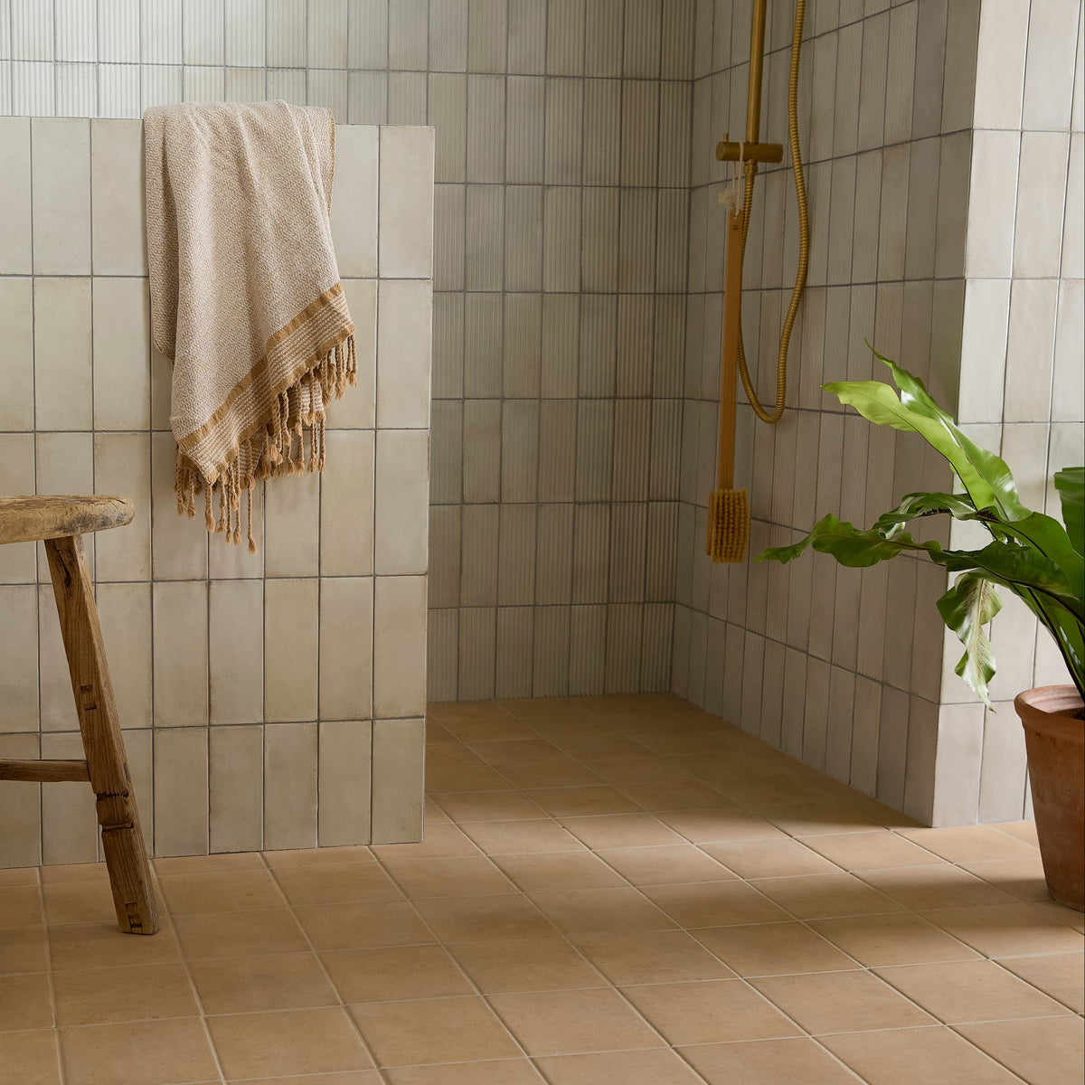 Fontenay Porcelain Pleated Wall Tiles beige pleated porcelain tiles with a fringed towel