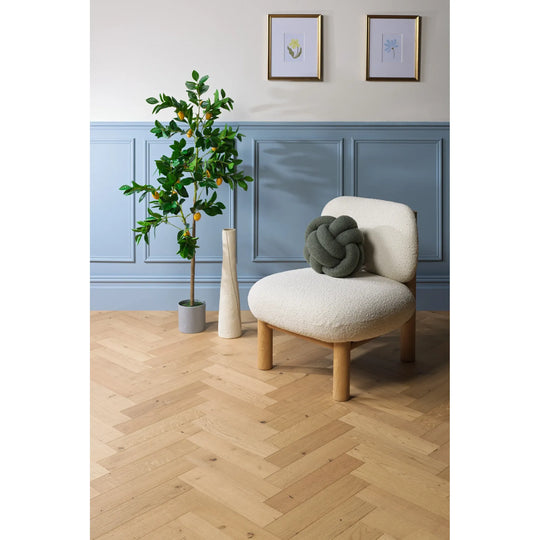 Harlech Natural Oak herringbone engineered wood flooring in a bright living room