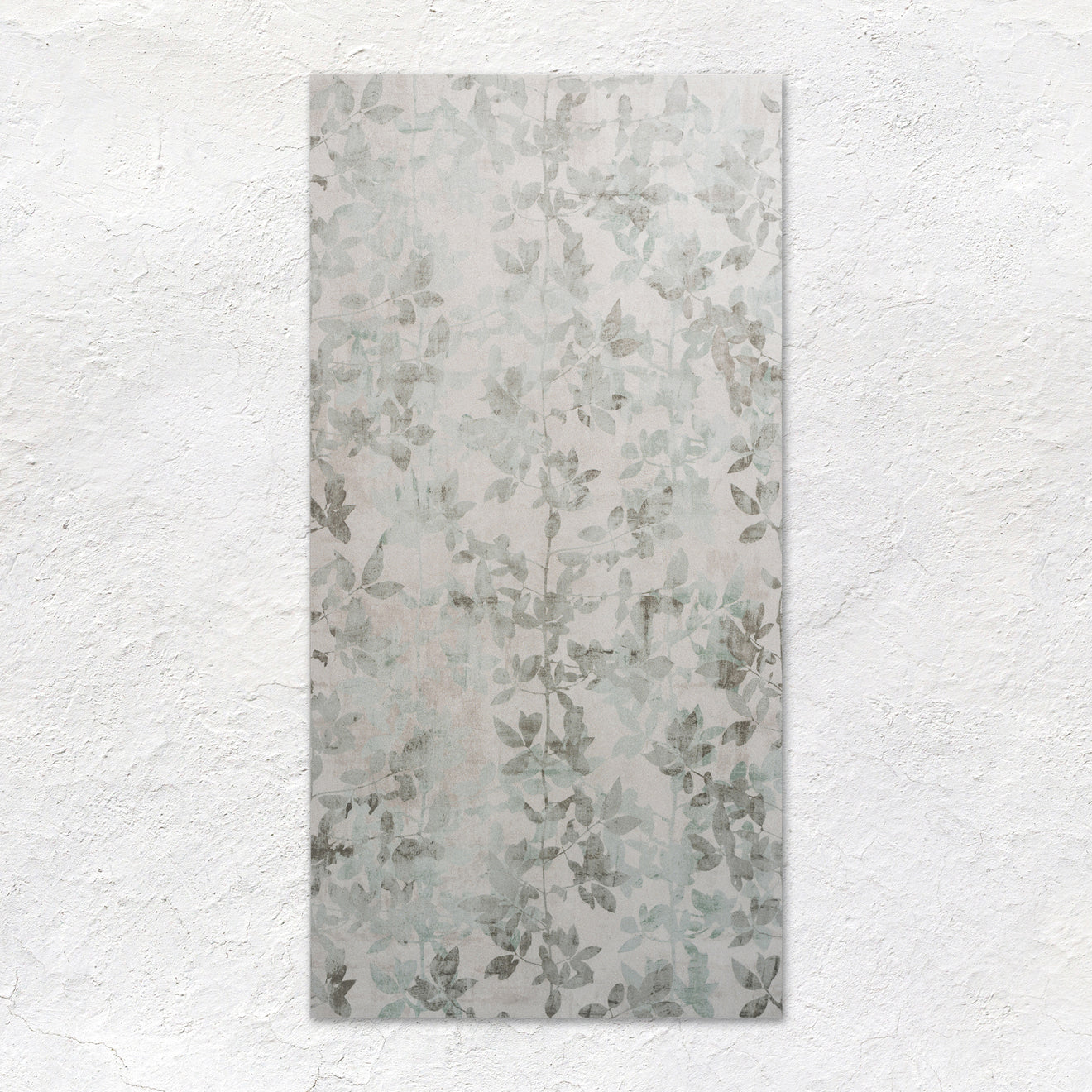Eden Pergola 60x30cm rectangular wall tile with subtle muted gray leaf pattern on a light textured surface