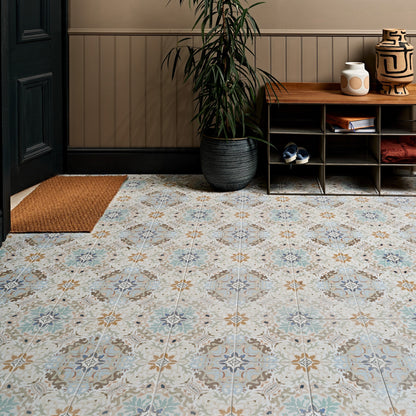 Patterned Kashmir porcelain plaster floor tiles with vintage ornate design in muted blue beige and brown tones