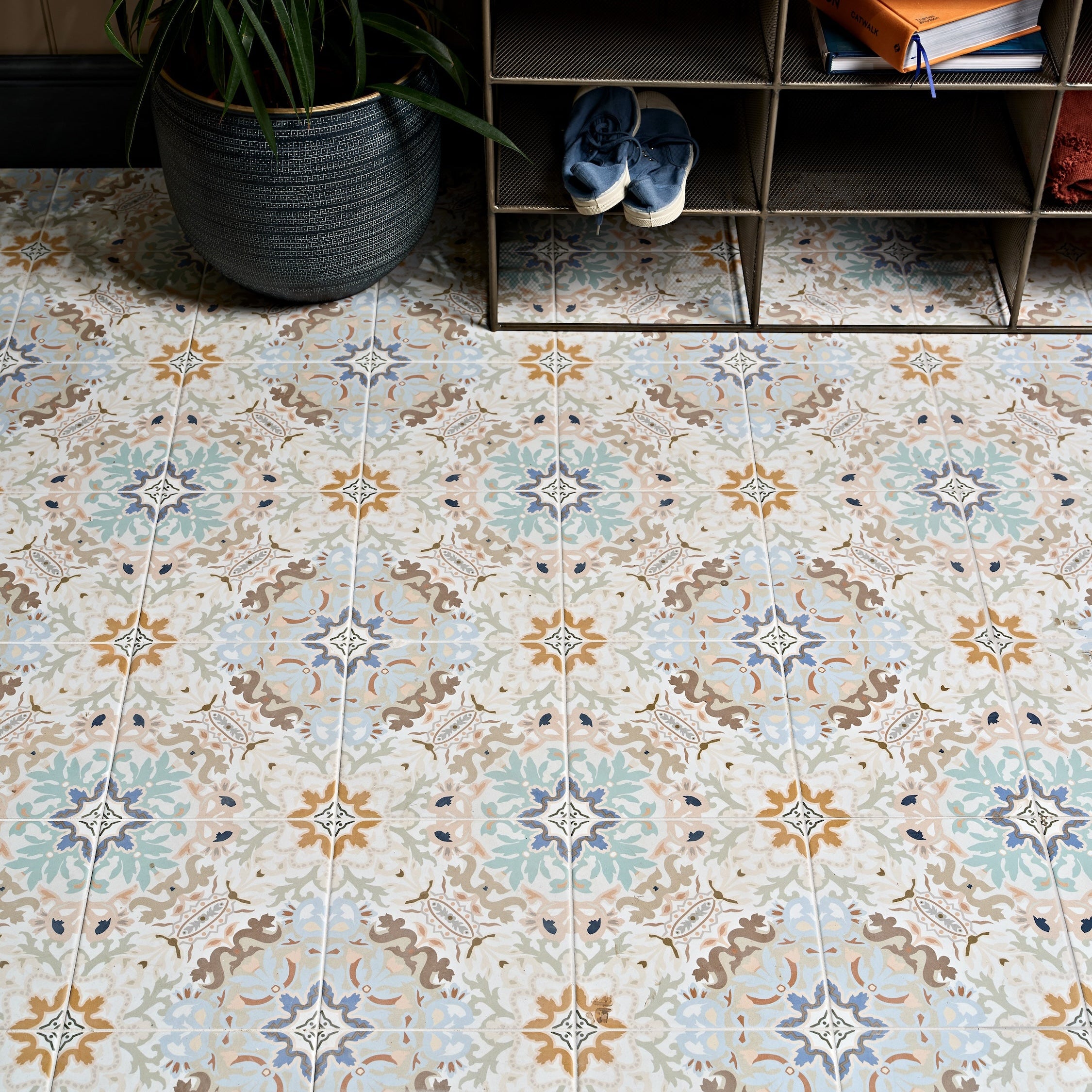 Kashmir porcelain plaster floor tiles with vintage floral pattern in muted blue beige and brown tones