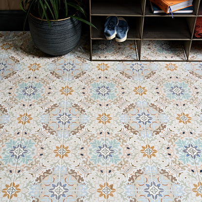 Kashmir porcelain plaster floor tiles with vintage floral pattern in muted blue beige and brown tones