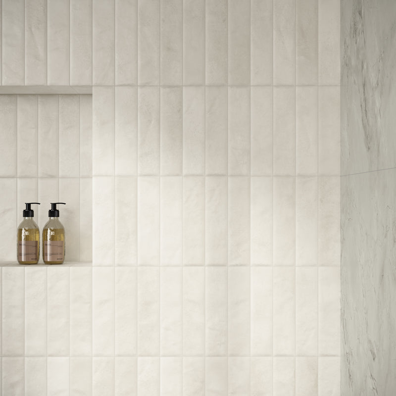Ceren Mini Bianco Polished 6 x 24cm Wall Tile in a room setting