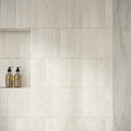 Ceren Mini Bianco Polished 6 x 24cm Wall Tile in a room setting
