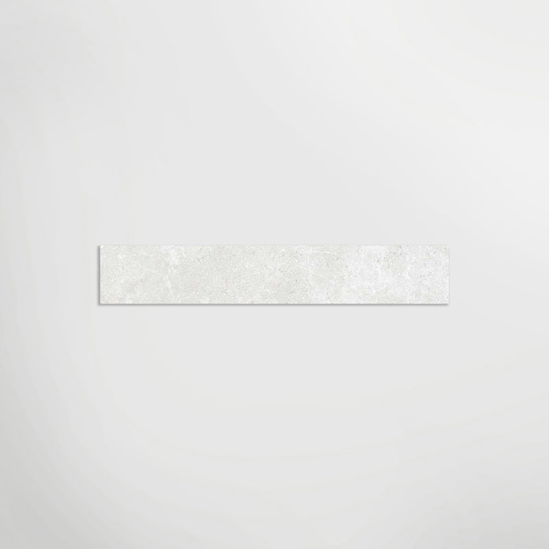 Elements Limestone Hauteville White Matt 90 x 7.5cm Skirting in a room setting