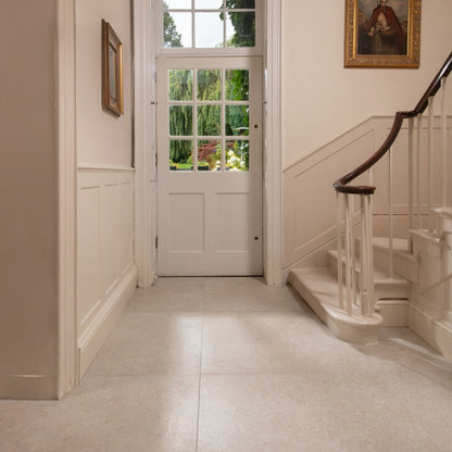 Illusion White Honed 90 x 90cm Wall & Floor Tile in a room setting