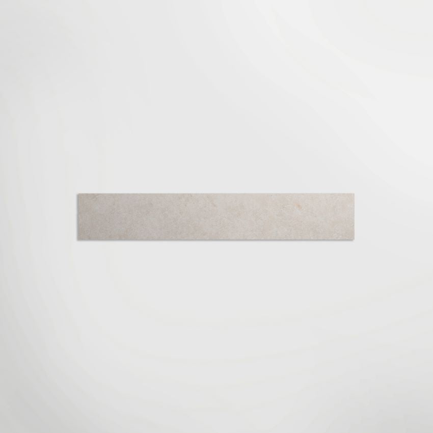 Illusion White Honed 90 x 7.2cm Skirting in a room setting
