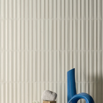 Rimo Mini Butter Polished 6 x 24cm Wall Tile in a room setting