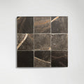 Roman Bronze Fantasy Squares marble tiles laid on a wall
