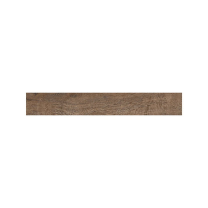 Dark walnut wood effect tiles laid in a herringbone pattern across a kitchen floor
