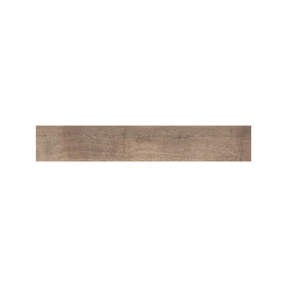 Dark walnut wood effect plank tiles laid across a kitchen floor, Fired Earth Lyndhurst