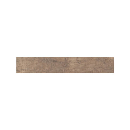 Deep brown Lyndhurst Walnut wood effect floor tiles in a living space roomset