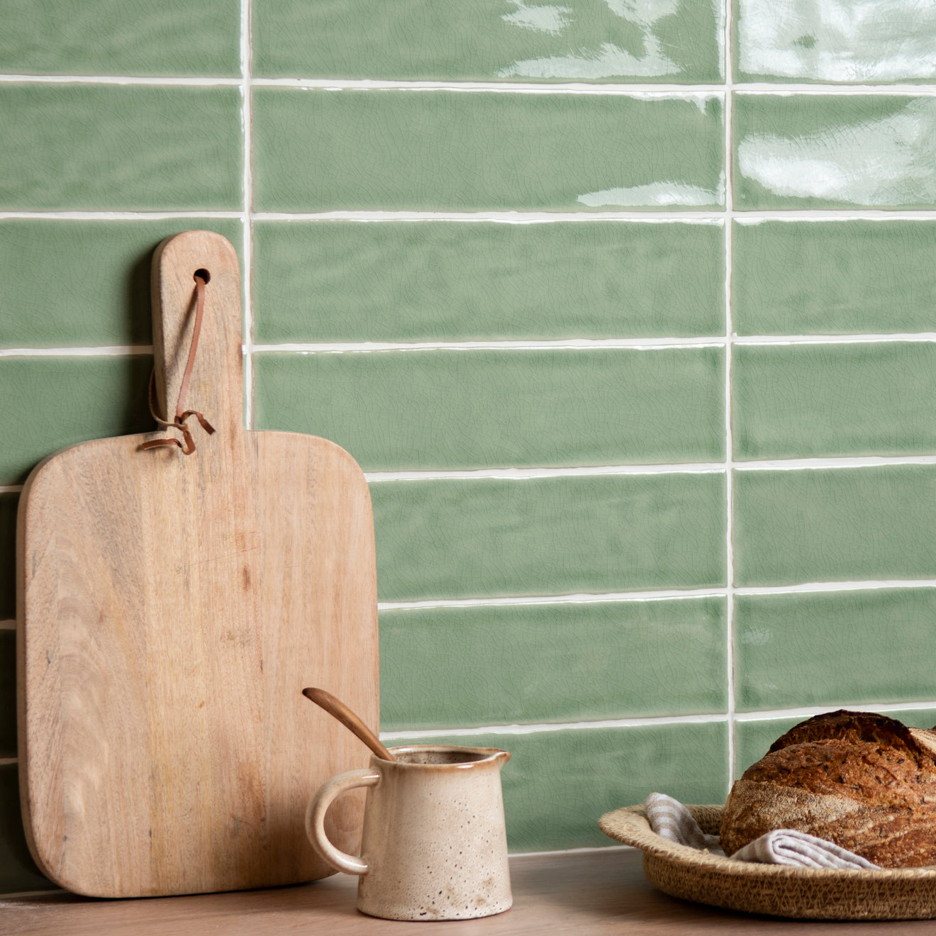 Large brick tile estuary with light green glossy rectangular tiles and white grout in a horizontal pattern