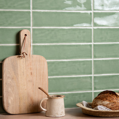 Large brick tile estuary with light green glossy rectangular tiles and white grout in a horizontal pattern