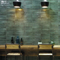 Lisbon Green Jade Shine green ceramic tiles behind a bar counter