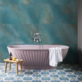 Maldives Porcelain Lagoon teal porcelain tiles with a lavender freestanding bathtub