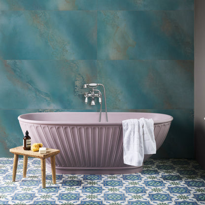 A lavender freestanding porcelain bathtub with vertical fluted detailing and chrome faucet Maldives Porcelain Lagoon