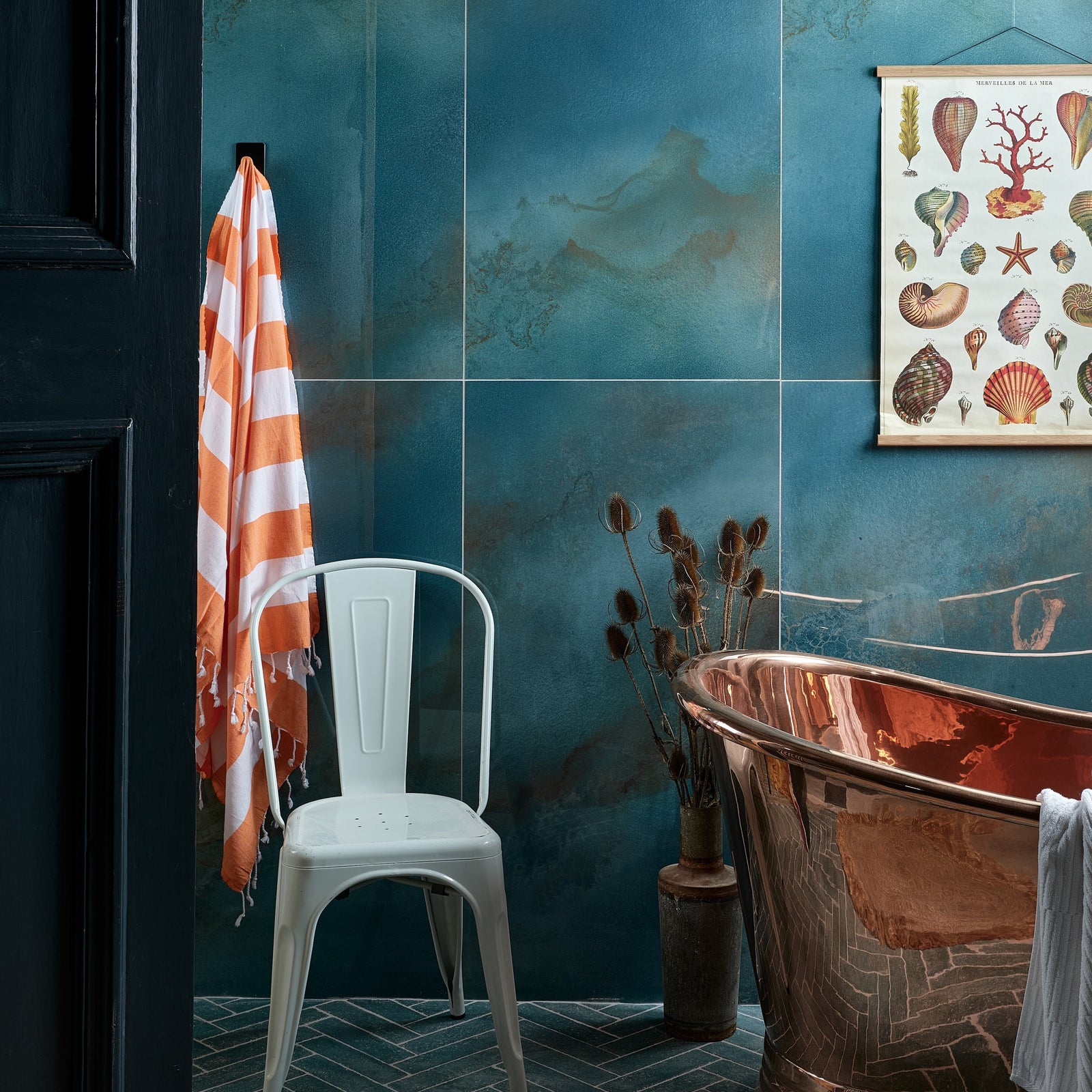 Maldives Porcelain Lagoon teal porcelain tiles with a copper bathtub