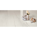 Marvel Bianco Dolomite Lappato white marble-effect tiles with a ceramic vase of roses