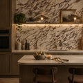 Modern kitchen with marble backsplash and wooden island