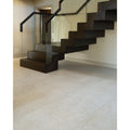 Purbeck Porcelain beige stone-effect tile laid across a floor